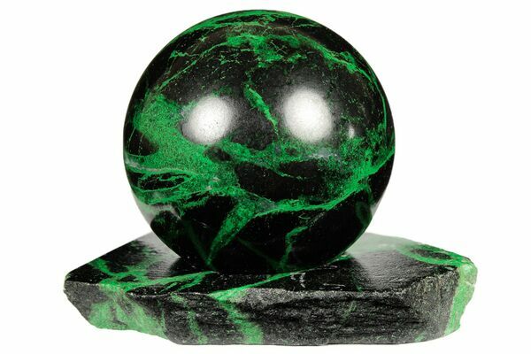 A polished sphere containing veins of Uvarovite garnets from Russia